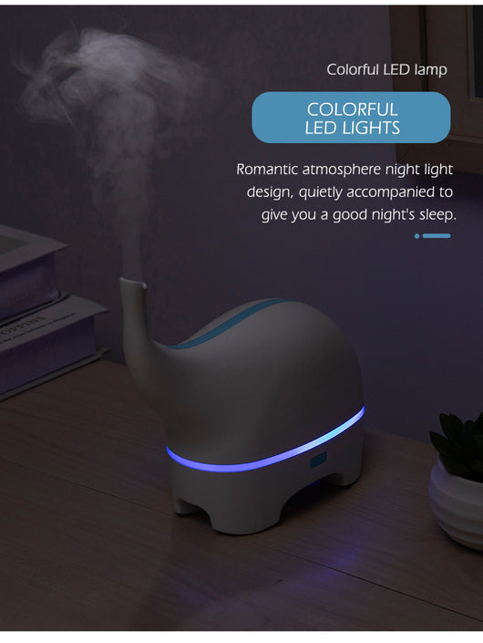 Pink elephant-shaped ultrasonic aromatherapy machine with a subtle light band and trunk-like mist outlet. - Image 6