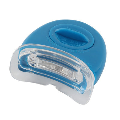 Teeth whitening kit with a blue LED light mouthpiece and a syringe of whitening gel on a white background. - Image 3