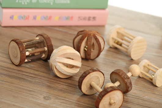 Set of natural wooden hamster toys including dumbbell shapes, a spherical bell toy, and two cylindrical bell toys, with a hamster. - Image 9