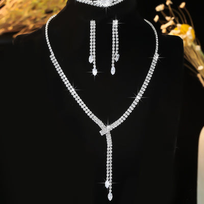 Sparkling rhinestone necklace, dangle earrings, and bracelet set on a black display, perfect for formal events. - Image 9