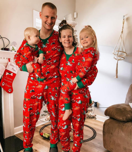 Red long-sleeved men's pajama set with a festive dinosaur and Christmas tree print, featuring green cuffs. - Image 2