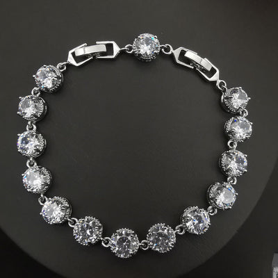 Four-piece silver-tone jewelry set with round green gemstones, including a necklace, bracelet, ring, and dangle earrings. - Image 23