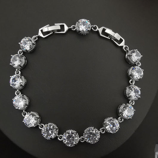 Four-piece silver-tone jewelry set with round green gemstones, including a necklace, bracelet, ring, and dangle earrings. - Image 23