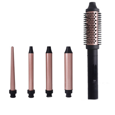 Five rose gold and black interchangeable hair styling attachments, including a round brush and various curling barrels. - Image 3