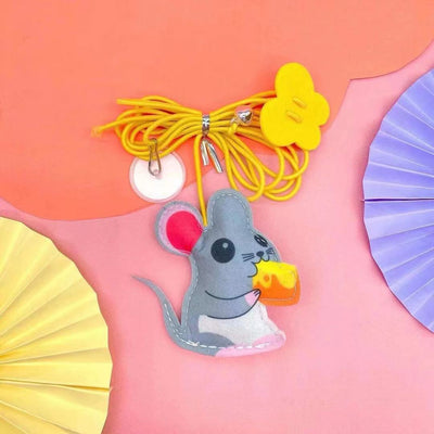 Colorful cat toy with pom-poms, googly eyes, white feathers, and a yellow elastic rope with a suction cup. - Image 8
