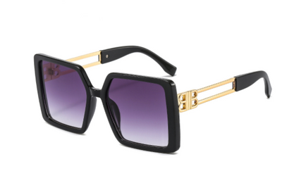 Women's large frame square sunglasses with black plastic frames, purple gradient lenses, and gold-tone metal temples. - Image 3