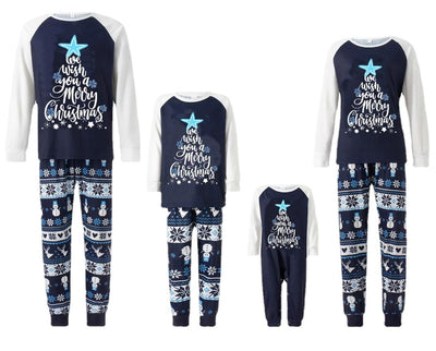 Matching family pajamas with navy blue and white raglan tops featuring a 'Let it Snow' graphic and snowman hat. Bottoms have a festive pattern of snowflakes, sn - Image 12