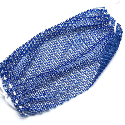 Close-up of a blue mesh fabric adorned with numerous small, clear rhinestones, creating a sparkling texture. - Image 46