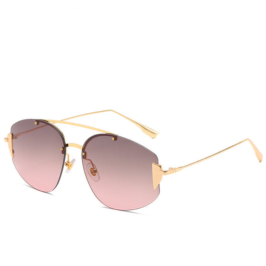 Women's fashion rimless sunglasses with blue to yellow gradient lenses and a gold-colored metal frame. - Image 6