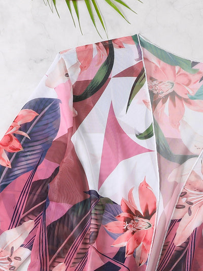 Woman in a three-piece bikini swimsuit set with a black tube top, floral boy shorts, and a sheer floral kimono cover-up. - Image 33