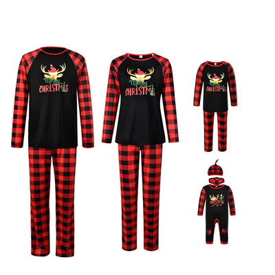 Family matching Christmas pajamas: black long-sleeve tops with white deer prints and red buffalo plaid pants. - Image 13