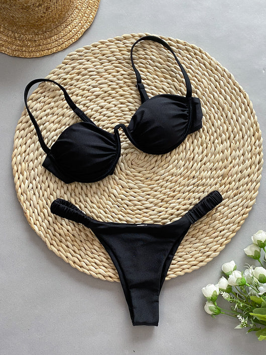 Rust underwire bikini set with ruched top and high-cut bottom, displayed on a woven mat. - Image 18