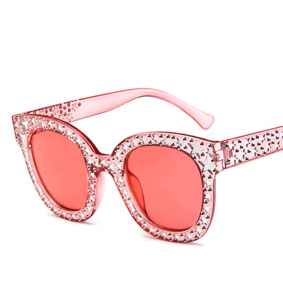 Black cat-eye sunglasses for ladies, featuring silver star embellishments on the frames and temples. - Image 16