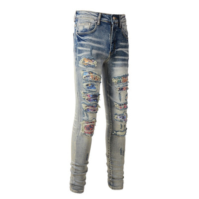Jeans Azul Bebé Desgastado con Parches Iridiscentes para Hombre