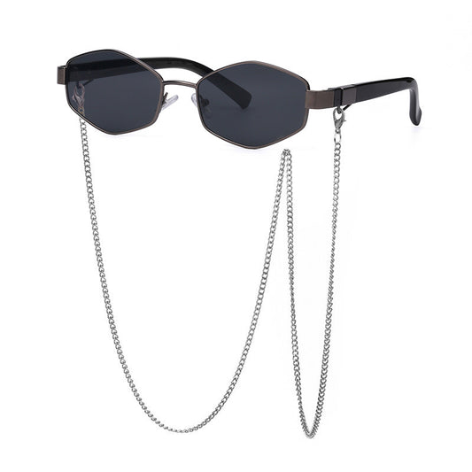 Women's hexagonal sunglasses with dark lenses, gold-colored metal frame, black temples, and a detachable gold chain. - Image 2