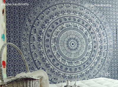 Gold and blue mandala tapestry with elephant and floral patterns, hung above a white quilted bed. - Image 10