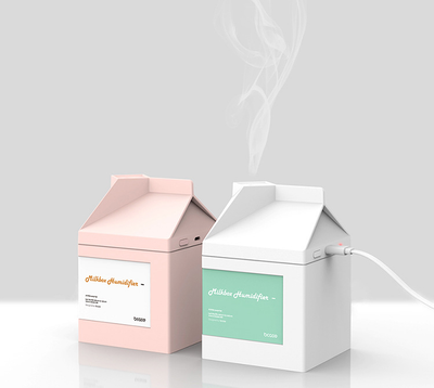Pink milk carton shaped humidifier with a white label, featuring "Milkbox Humidifier" text and a bcase logo.