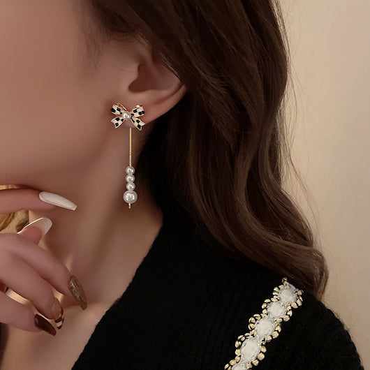 Aretes de Perla con Moño Elegante para Mujer