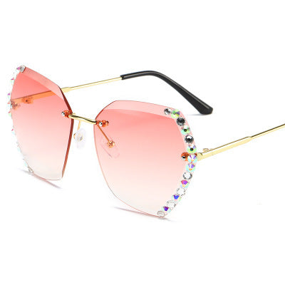 Women's rimless sunglasses with gradient gray lenses, gold-tone metal arms, and iridescent rhinestone embellishments. - Image 5
