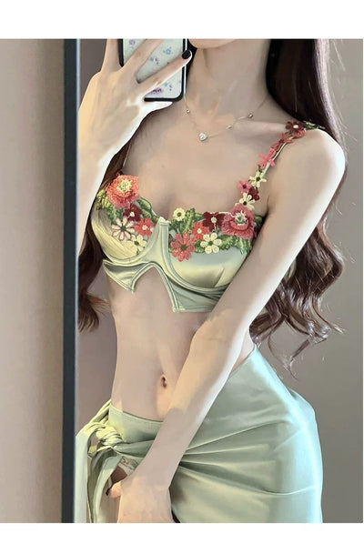 Women's light green three-piece bikini with floral embroidered triangle top, matching bottoms, and a sarong skirt. - Image 2