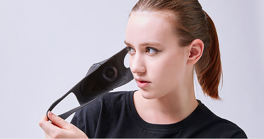 Black breathable face mask with an exhalation valve and ear loops, designed for autumn and winter fashion. - Image 2