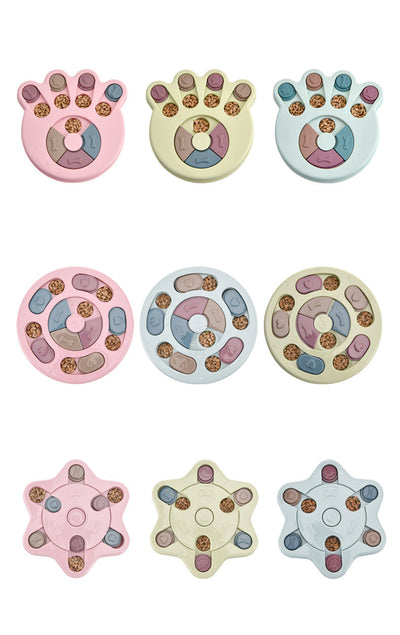 Paw-shaped dog puzzle feeder toy in light yellow with colorful sliding covers, filled with kibble. - Image 9