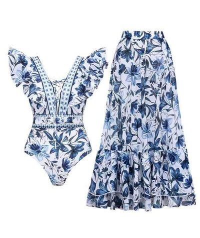 Women's blue and white floral one-piece swimsuit with ruffled V-neck and matching sarong skirt with bow. - Image 21