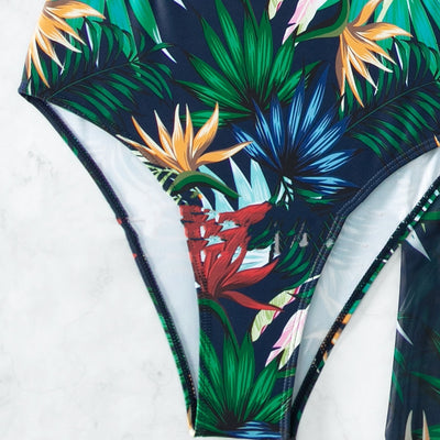 Yellow tropical print three-piece bikini set with halter top, high-waisted bottoms, and long cover-up skirt with high slit. - Image 5