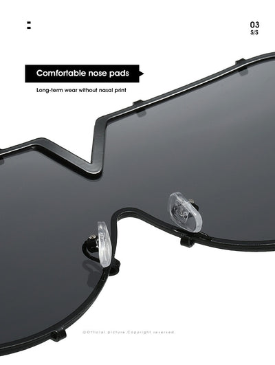 Oversized V-shaped sunglasses with a gold metal frame, white accents, clear lenses, and decorative rivets. - Image 18