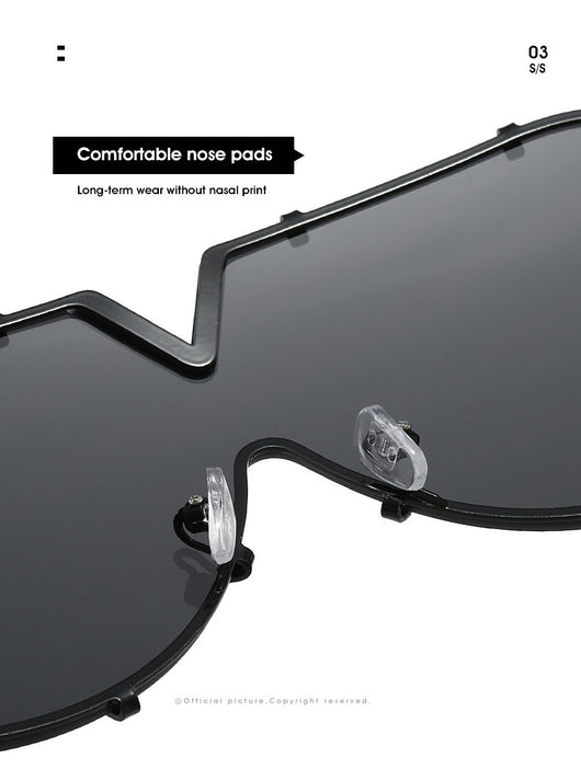 Oversized V-shaped sunglasses with a gold metal frame, white accents, clear lenses, and decorative rivets. - Image 18