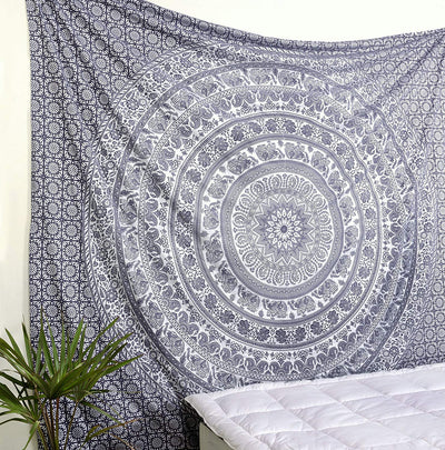 Gold and blue mandala tapestry with elephant and floral patterns, hung above a white quilted bed. - Image 9