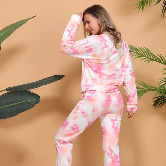 Woman wearing a pink and white tie-dye long-sleeve top and matching pants set, posing casually. - Image 18