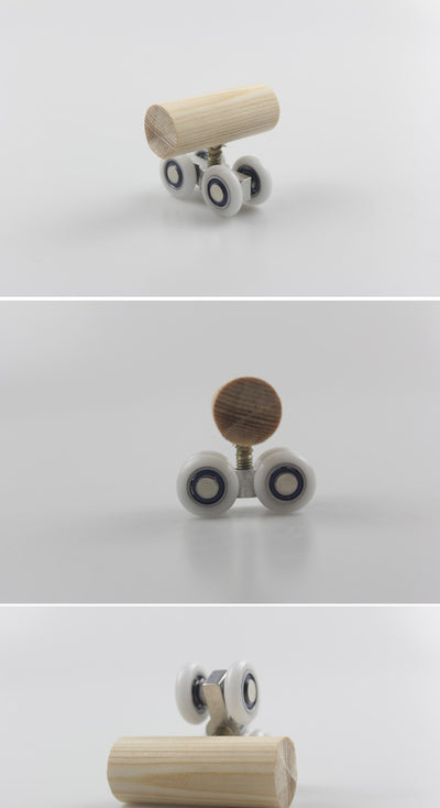 Wooden bird toy resembling a roller skate with a pine log body and four white wheels with metal bearings. - Image 9
