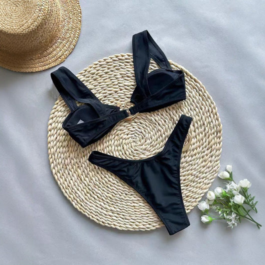 Black one-piece swimsuit with asymmetrical cutout design and gold-toned ring details, featuring a high-cut bottom. - Image 4
