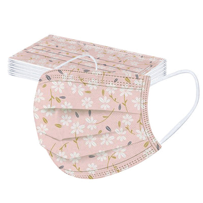 Stack of disposable facial masks with a watercolor floral pattern of red, pink, and orange roses and green leaves. - Image 17