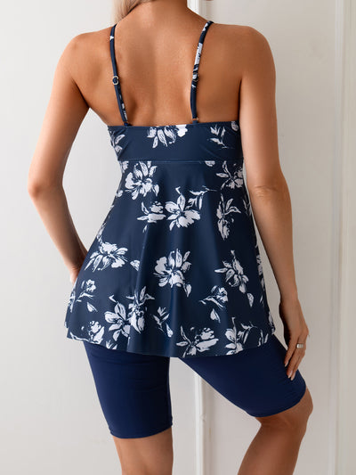 Women's navy blue two-piece swimsuit with white floral tankini top and matching solid swim shorts. - Image 19