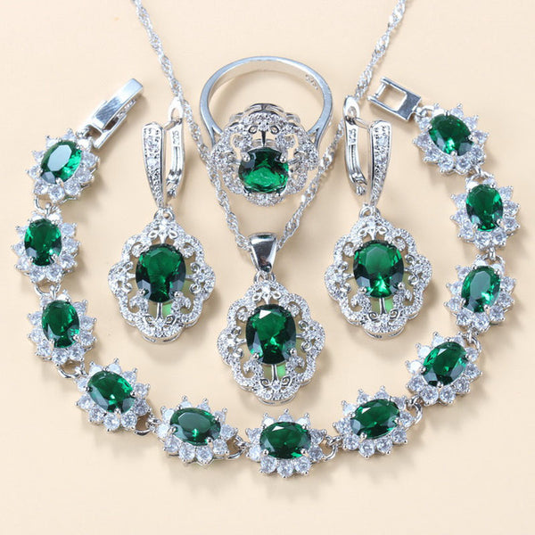Four-piece jewelry set with silver-tone settings, featuring oval purple cubic zirconia stones surrounded by clear accents. - Image 6