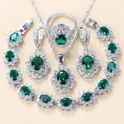 Four-piece jewelry set with silver-tone settings, featuring oval purple cubic zirconia stones surrounded by clear accents. - Image 6