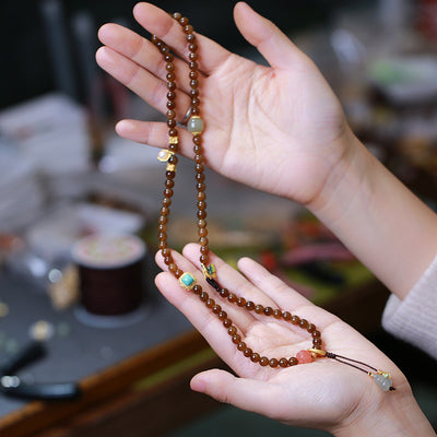 Pulsera de Tres Aros con Perla de Calabaza y Mariposa - Image 4