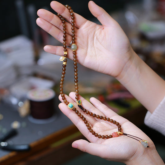 Pulsera de Tres Aros con Perla de Calabaza y Mariposa - Image 4
