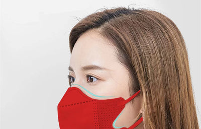 Peach disposable 3-layer face mask with perforated details worn by a person, offering comfortable daily protection. - Image 9