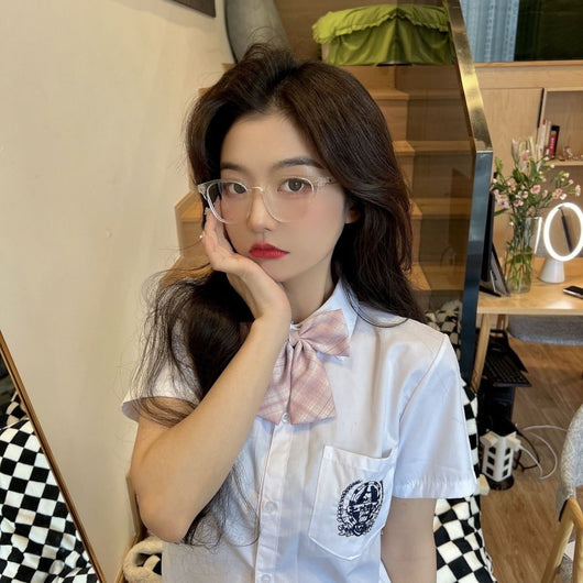 Retro square transparent full-frame glasses with blue light lenses, held by a person wearing grey sweatpants. - Image 14