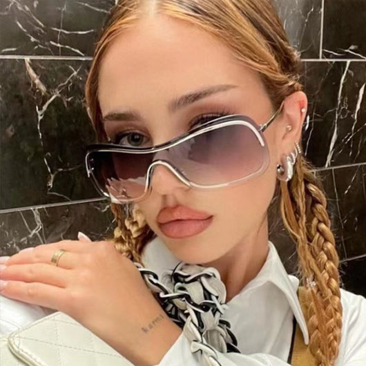 Women's fashionable shield sunglasses with a gold metal frame and dark gray lenses, featuring a unique wavy design. - Image 5