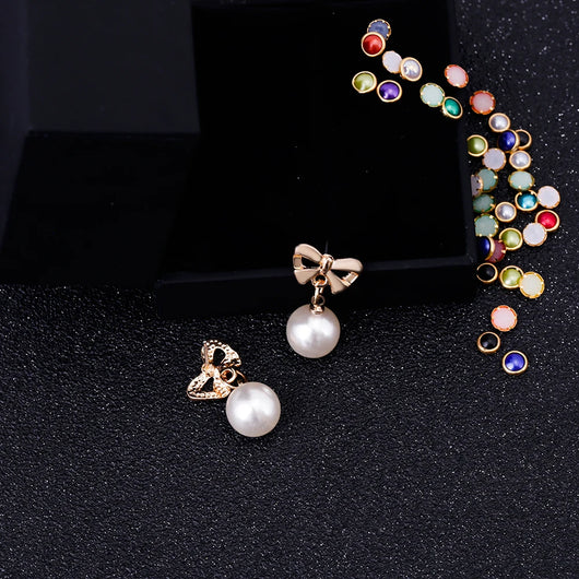 Aretes Elegantes de Corazón con Moño de Circonia y Perla - Image 13