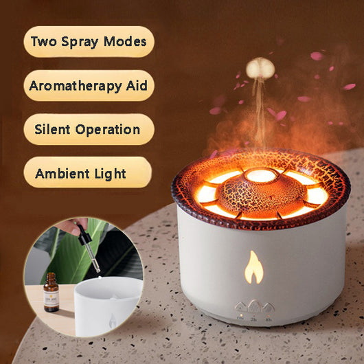 White ultrasonic essential oil diffuser with orange flame effect mist, alongside a gift set of Lavender, Peppermint, Tea Tree, and Sweet Orange essential oils. - Image 2