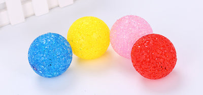 Assortment of colorful textured plastic cat toy balls in red, yellow, blue, purple, pink, and green. - Image 11