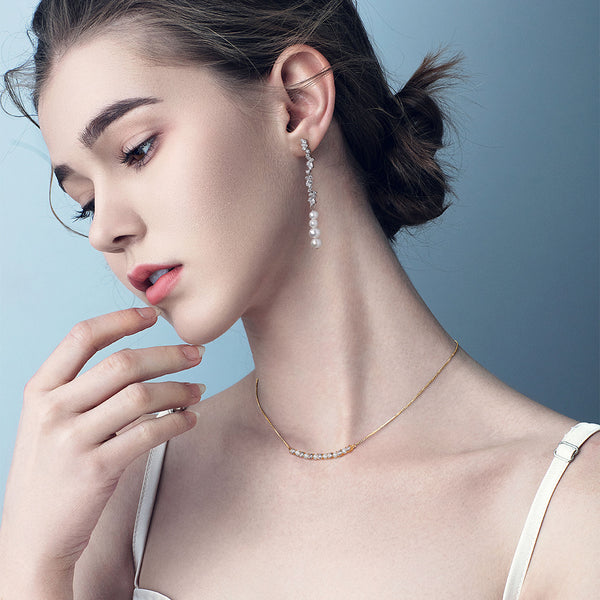Aretes de Perla Brillante con Borla y Circonita Incrustada