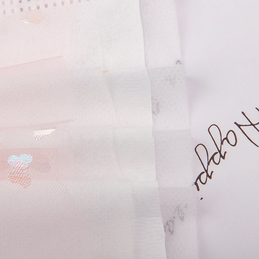 Light blue disposable face mask with iridescent butterfly patterns and white ear loops for dust protection. - Image 14