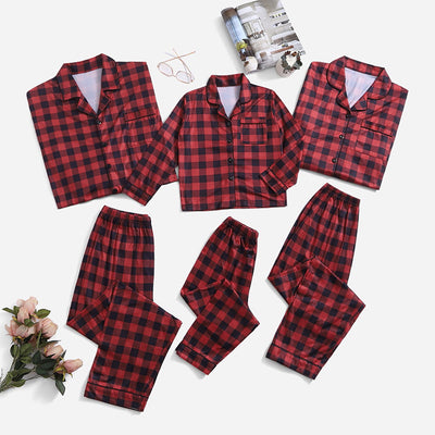 Three dark blue family pajama sets with white and light blue snowflake patterns, featuring long-sleeve tops and pants. - Image 13