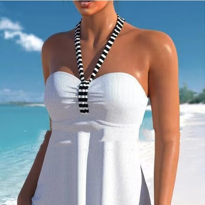 Green ribbed off-shoulder tankini top with striped halter strap and black and white striped boy short swimsuit.